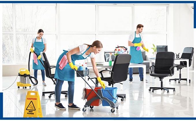 A team of dedicated janitors in professional uniforms working together to provide meticulous commercial janitorial solutions, ensuring immaculate cleanliness in your business environment.