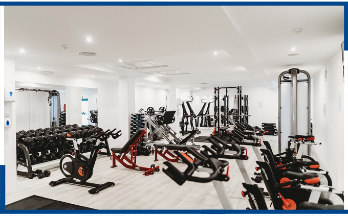 A clean and well-equipped gym interior, showcasing the results of B&J Cleaning's fitness center cleaning services.